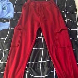 Red sweatpants with leg pockets. Pretty thick and good quality.